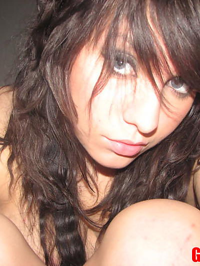 Cute teen takes self pictures of herself in and out of her little lace top