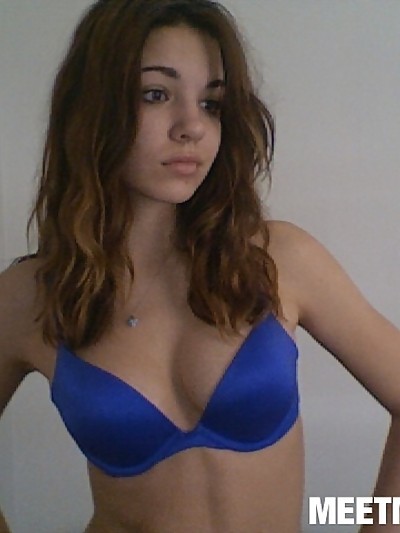 Sexy teen Kimberly shows off her amazing perky cleavage