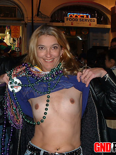 Girls flashing for beads at mardi gras
